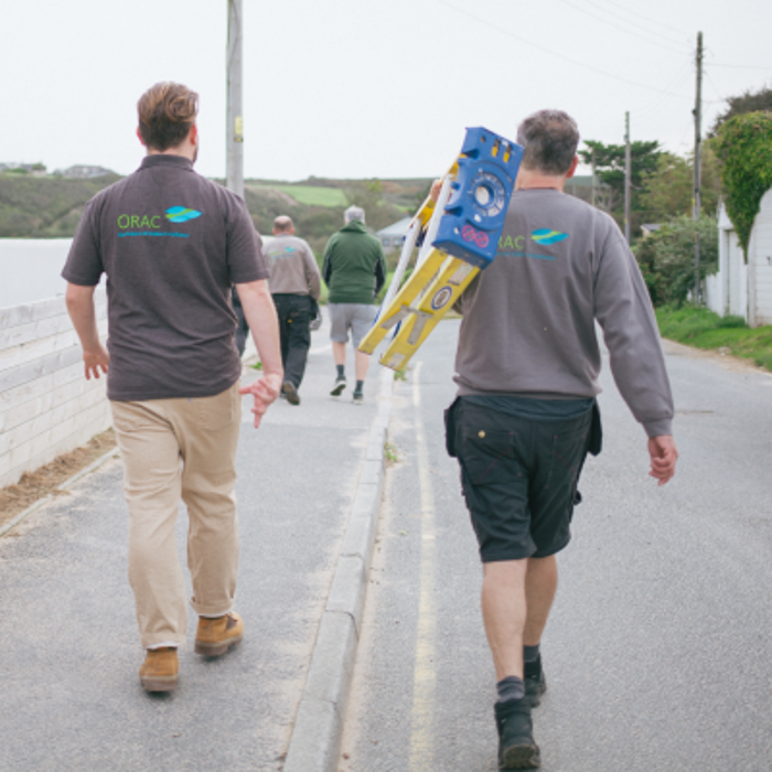 Team walking away showing the Reef logo on their uniform